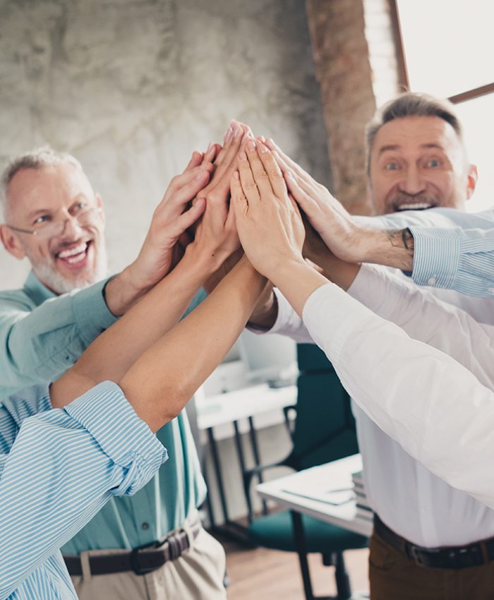 Photo of teamwork startup partners highfive cheerful support comfortable nice creative startup office loft room interior.