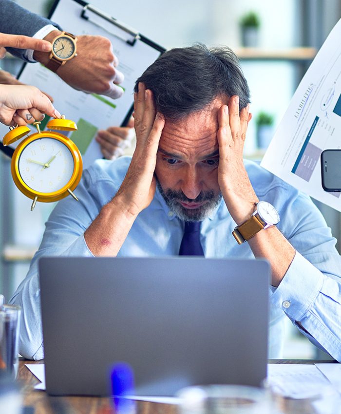 Group of business workers working together. Partners stressing one of them at the office